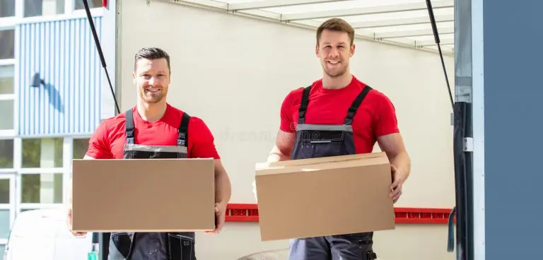 happy male movers holding cardboard boxes young standing moving van 211152207