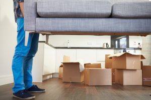 Man Carrying Sofa When Moving into New House 1